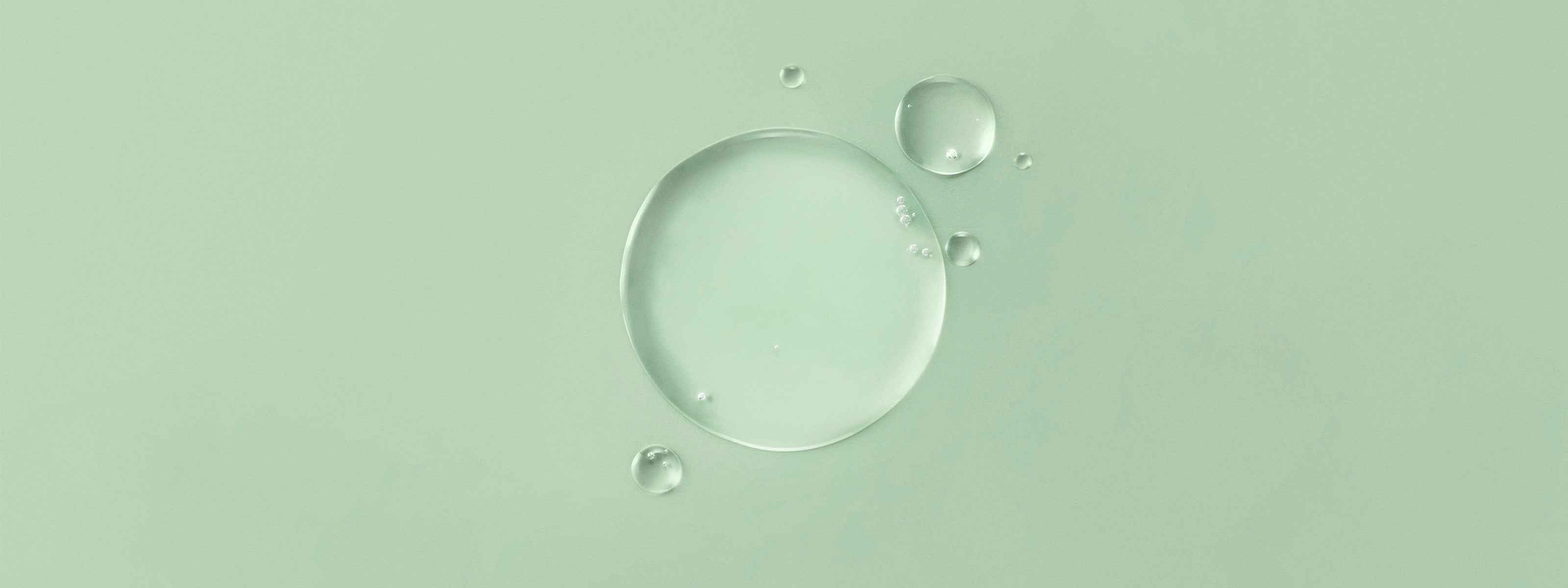 Flüssige Textur auf grünem Hintergrund